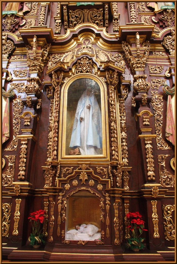 a church alter with gold paint on it