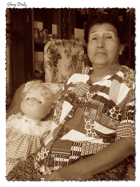 an old woman sitting with her child on a chair