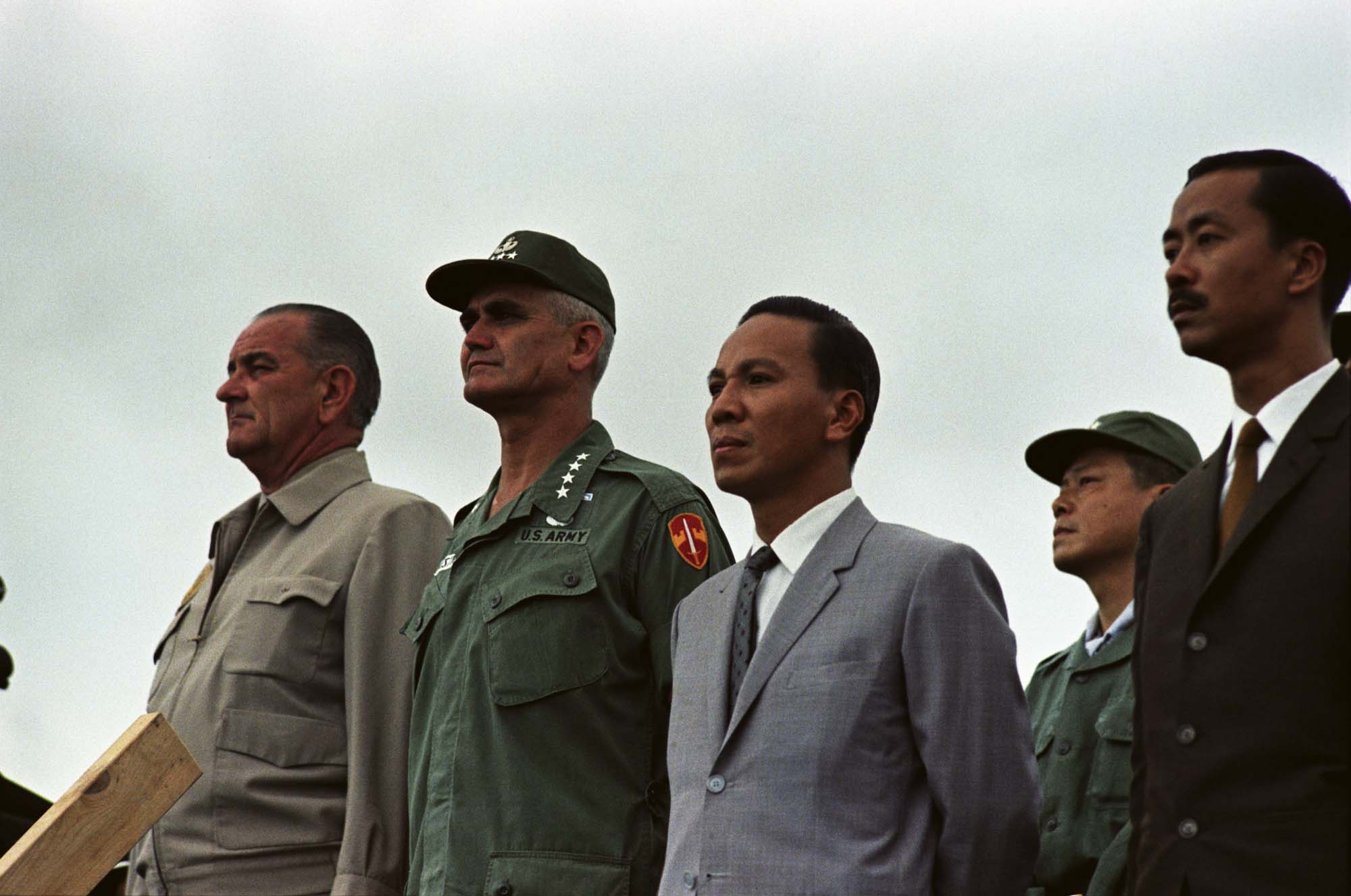 a line of men in suits and ties