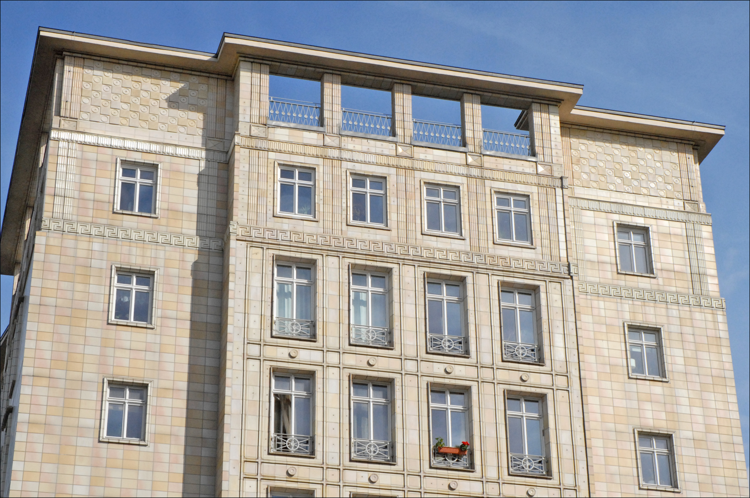 this old building has very modern windows and stone facade