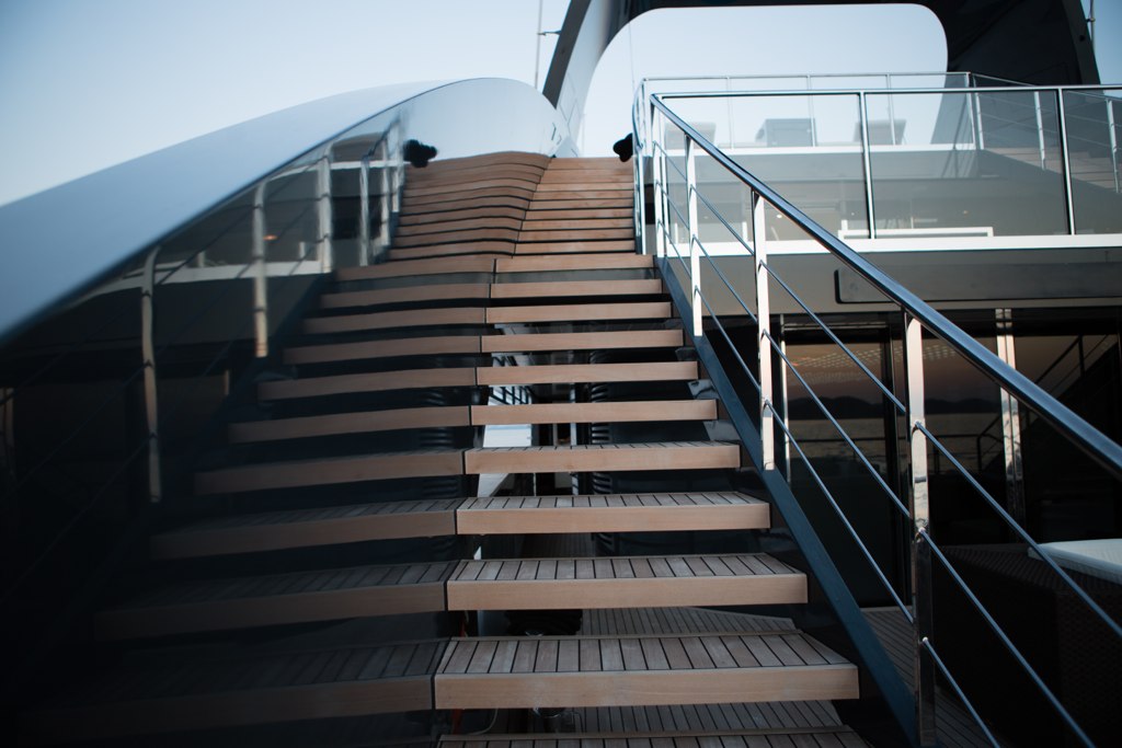 a stair case with several steps near a large boat