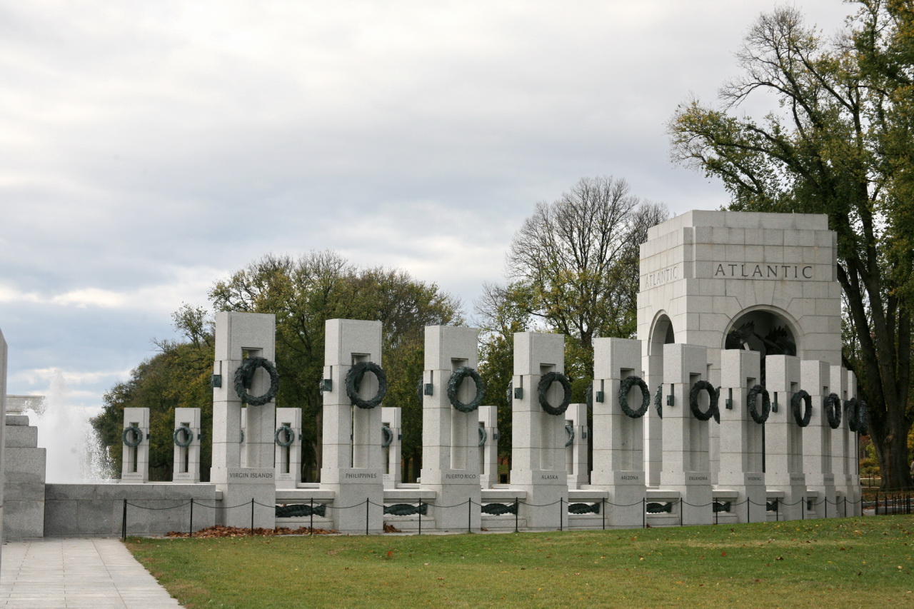 a monument of words and flowers in a park