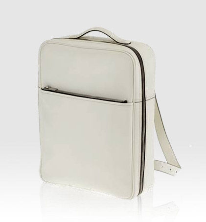 a white backpack sitting on top of a table