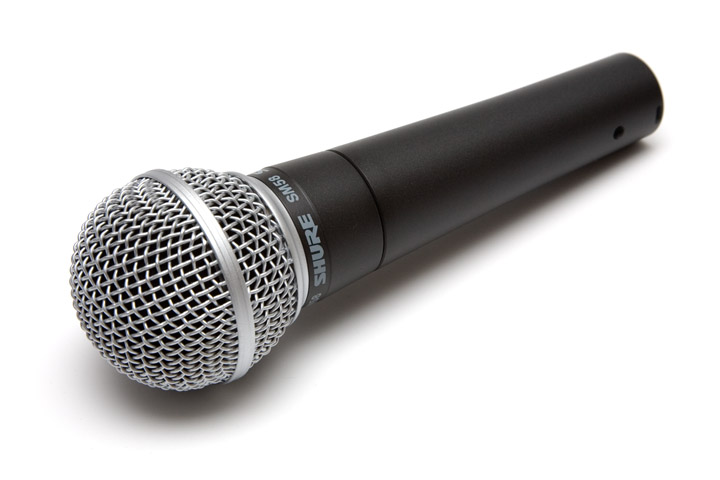 an old black microphone with a long tail