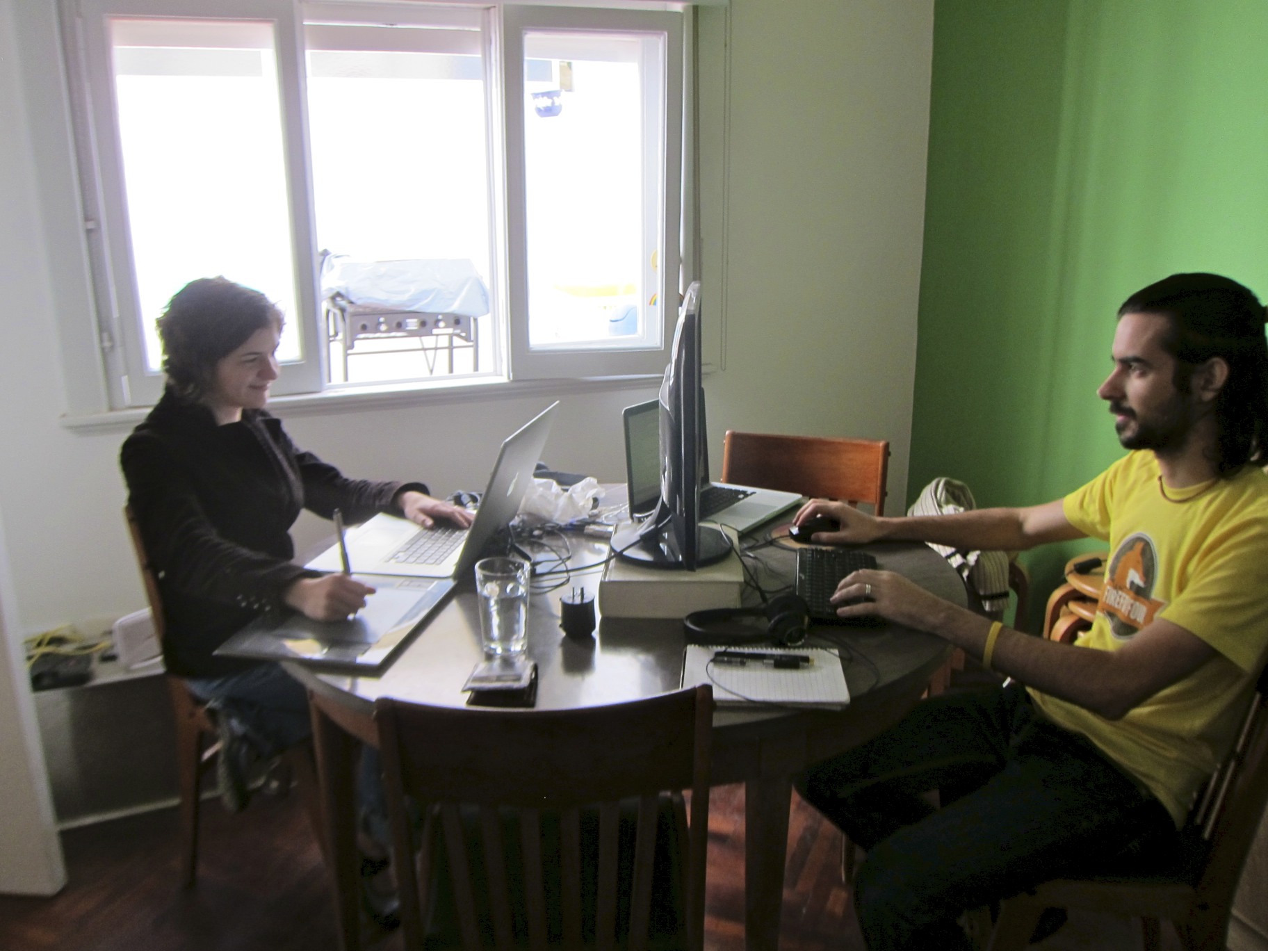 a man sitting at a desk with his computer