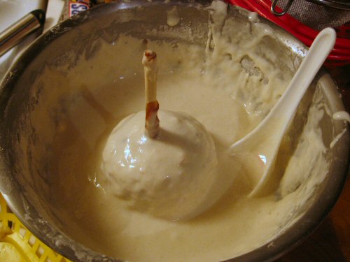a bowl with the batter is mixing into it