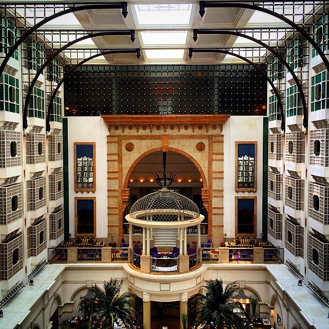 the atrium inside a el lobby with an ornate dome