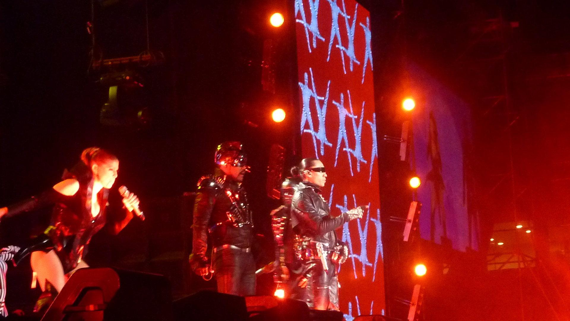 group of people on stage with the words papa papa papa papa in neon colored lights