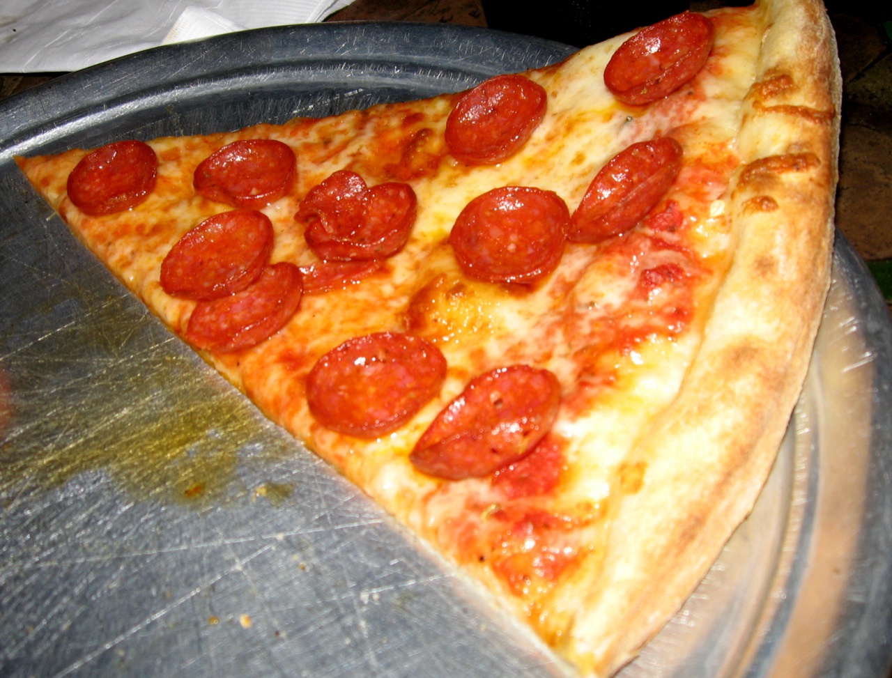 slices of pepperoni pizza on a serving pan