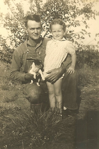 an old black and white pograph of two people and a dog