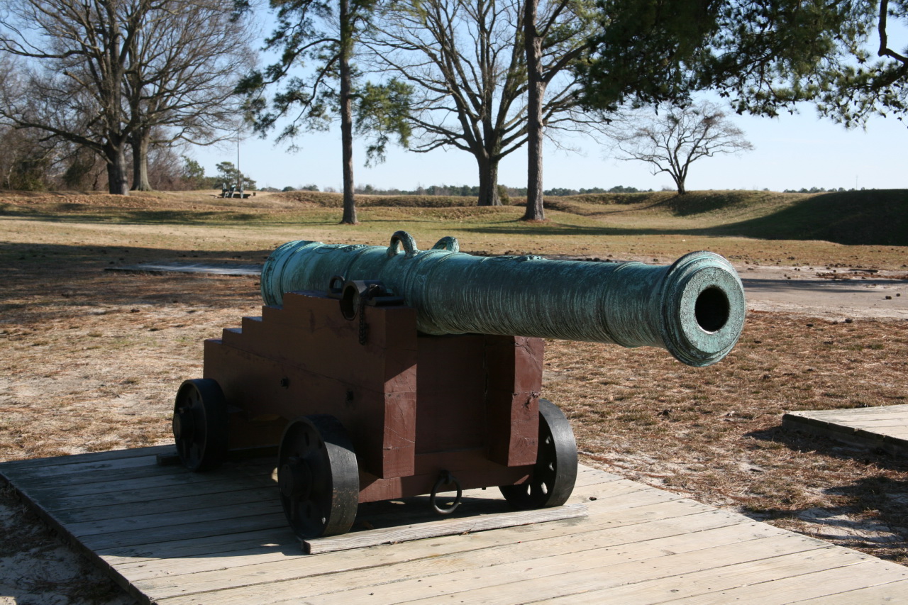 a cannon sits on display on wooden decks