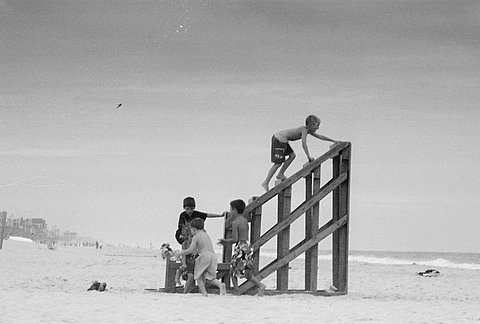 the people are walking out onto the beach