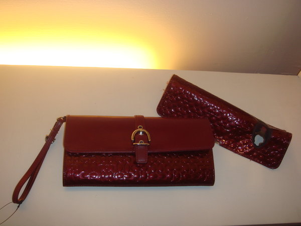 a pair of purses with two strap options