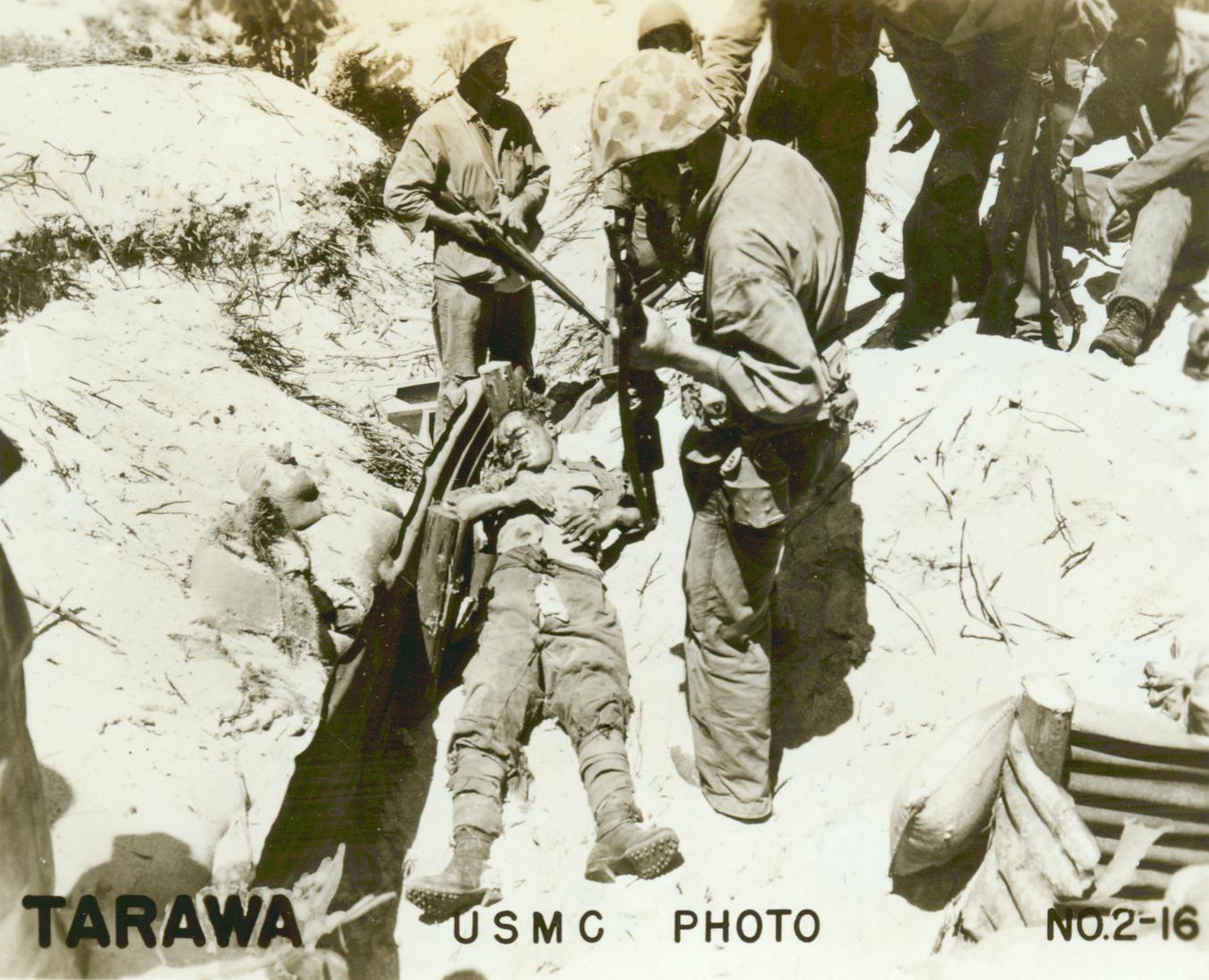 people on the side of a dirt hill wearing us army clothing