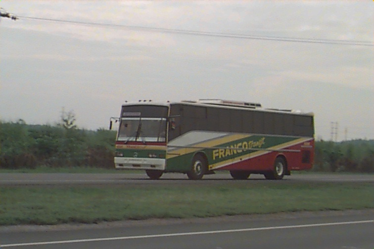 a bus is parked in front of the road