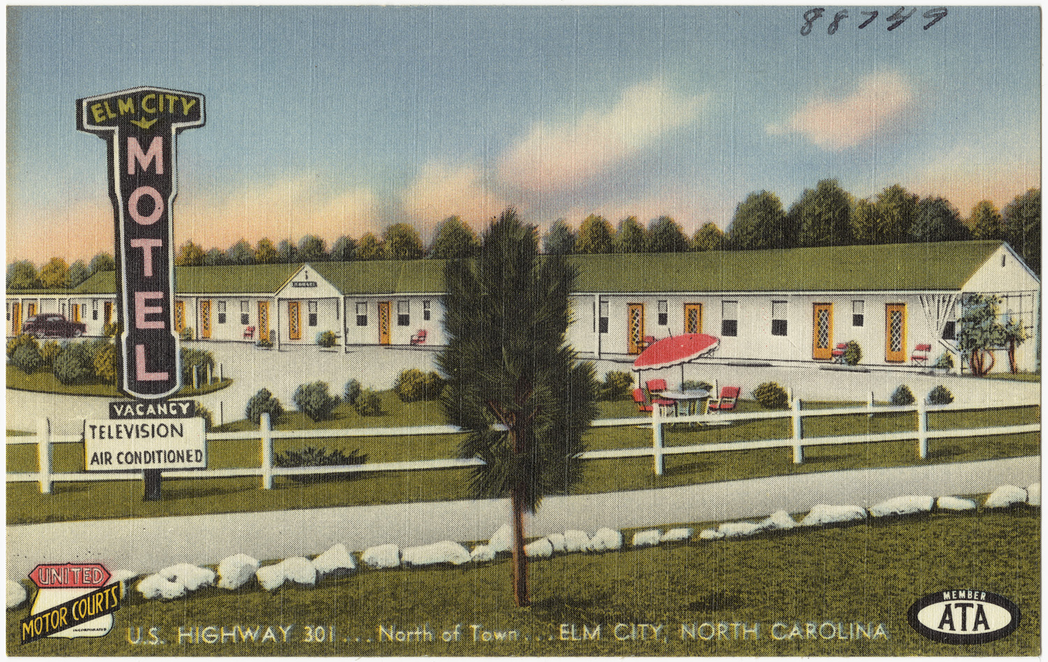 an old postcard from the 1930s depicting the motel and surrounding