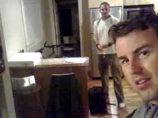 two men are standing in the kitchen together