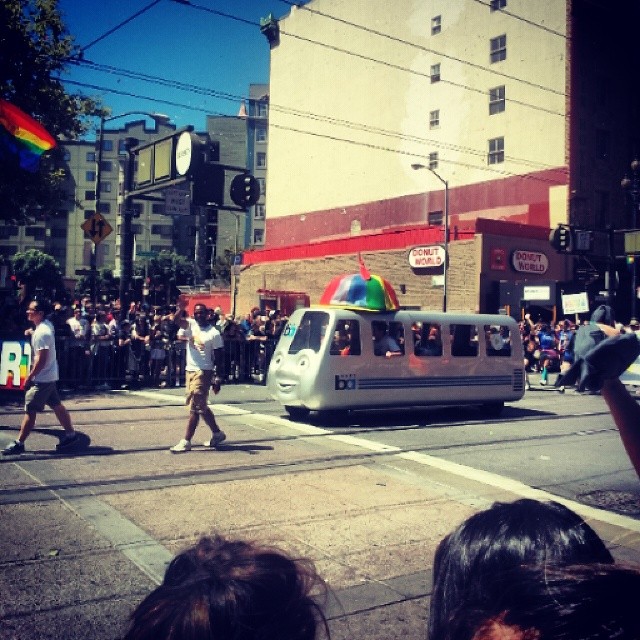 a crowd of people marching down a city street