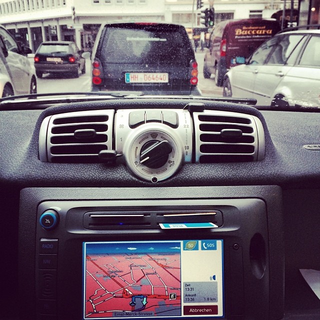 a vehicle dashboard with its dash camera recording traffic