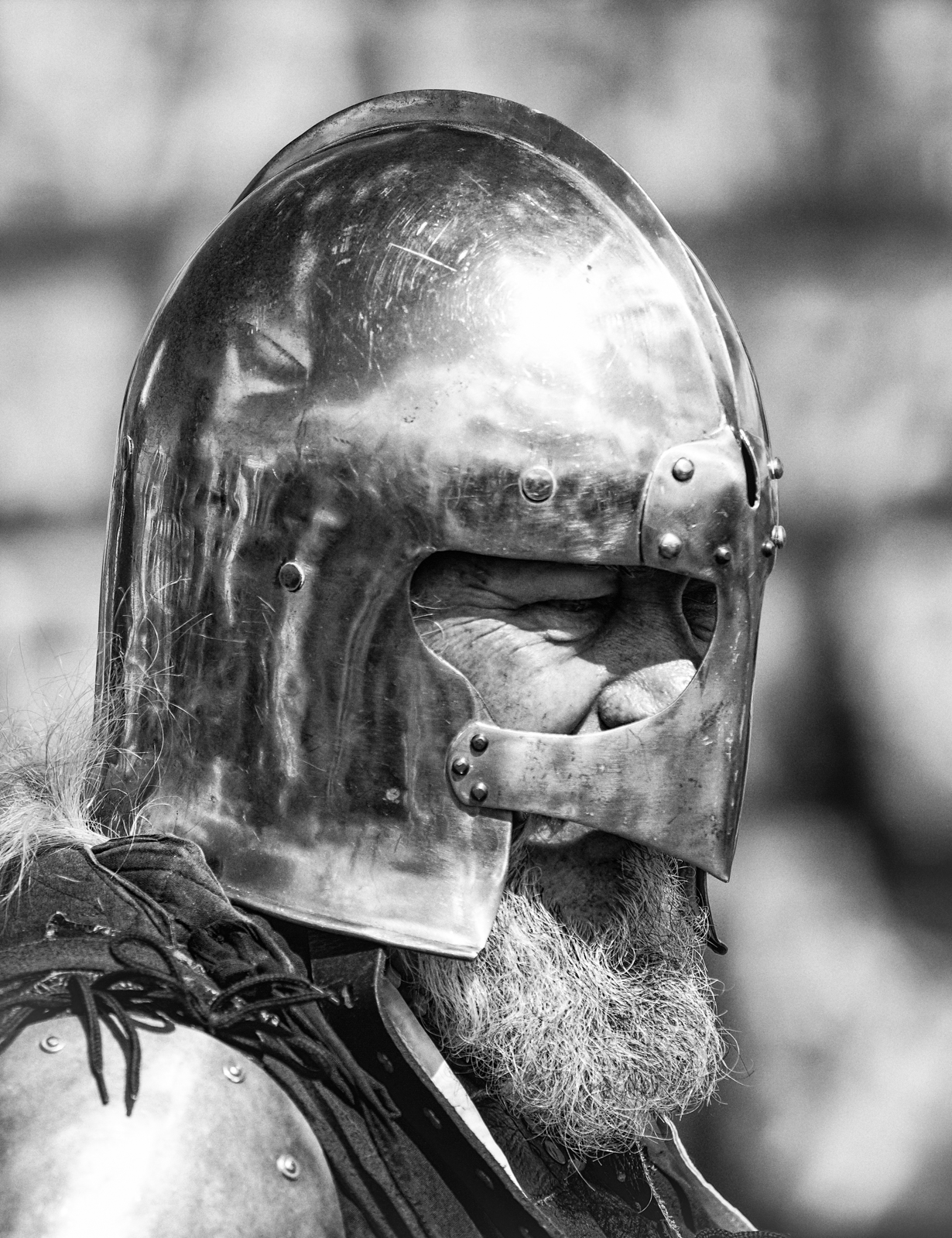the helmet of a man is worn with a beard