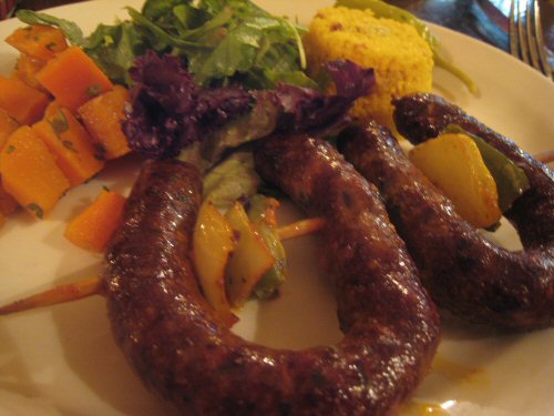 there are several types of sausages on the plate
