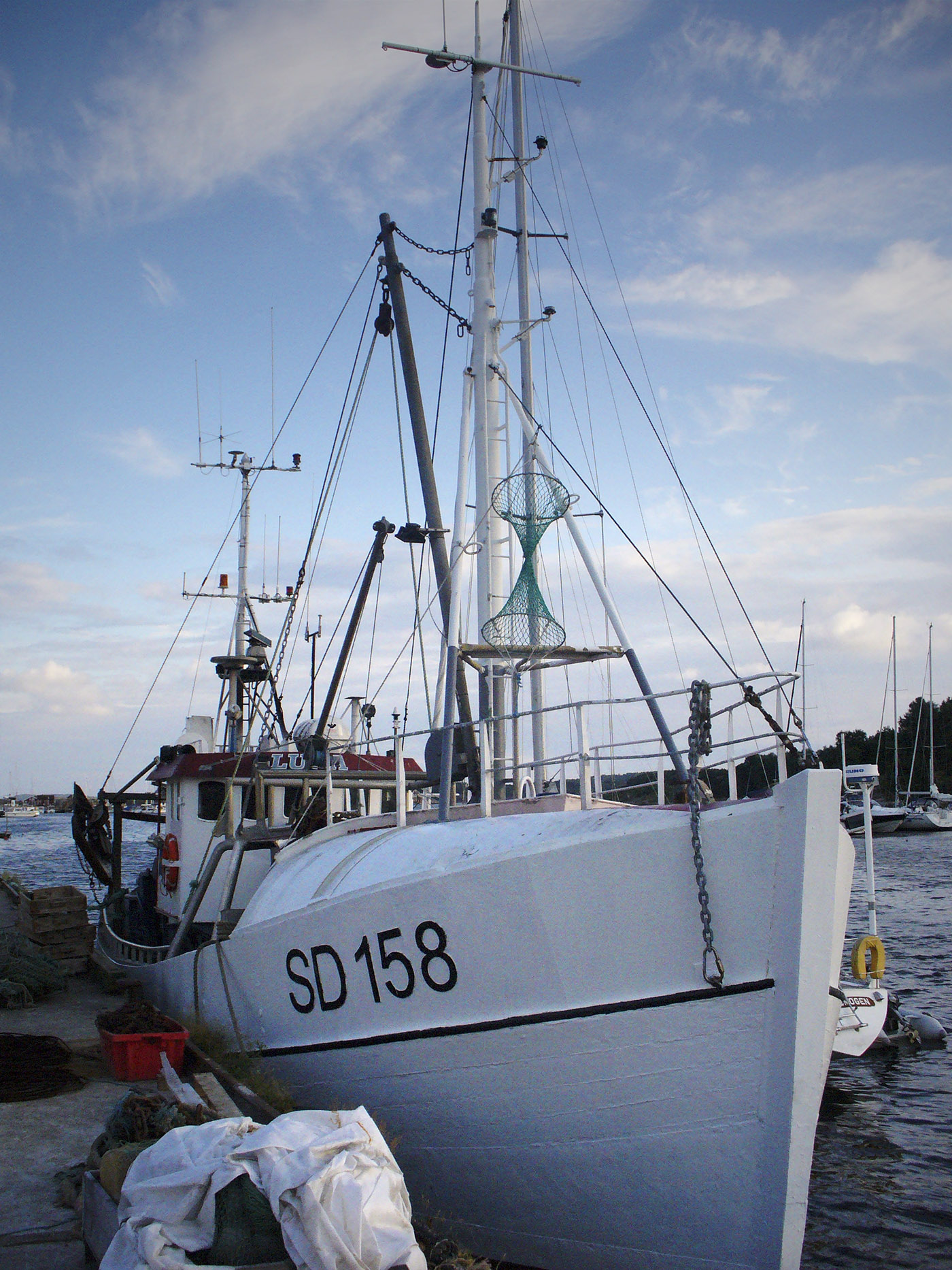 the large, white boat is parked in the water