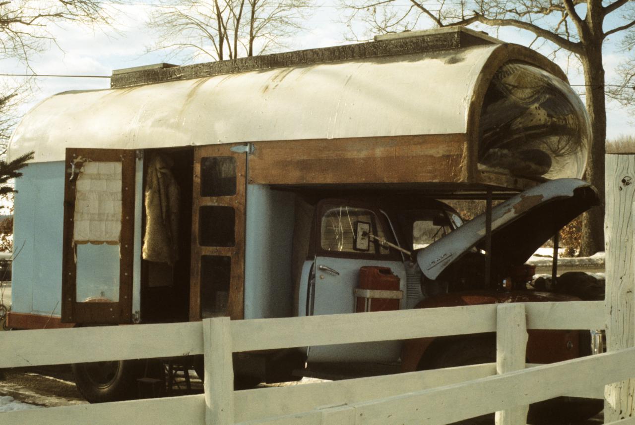 an old rusty truck with the door open