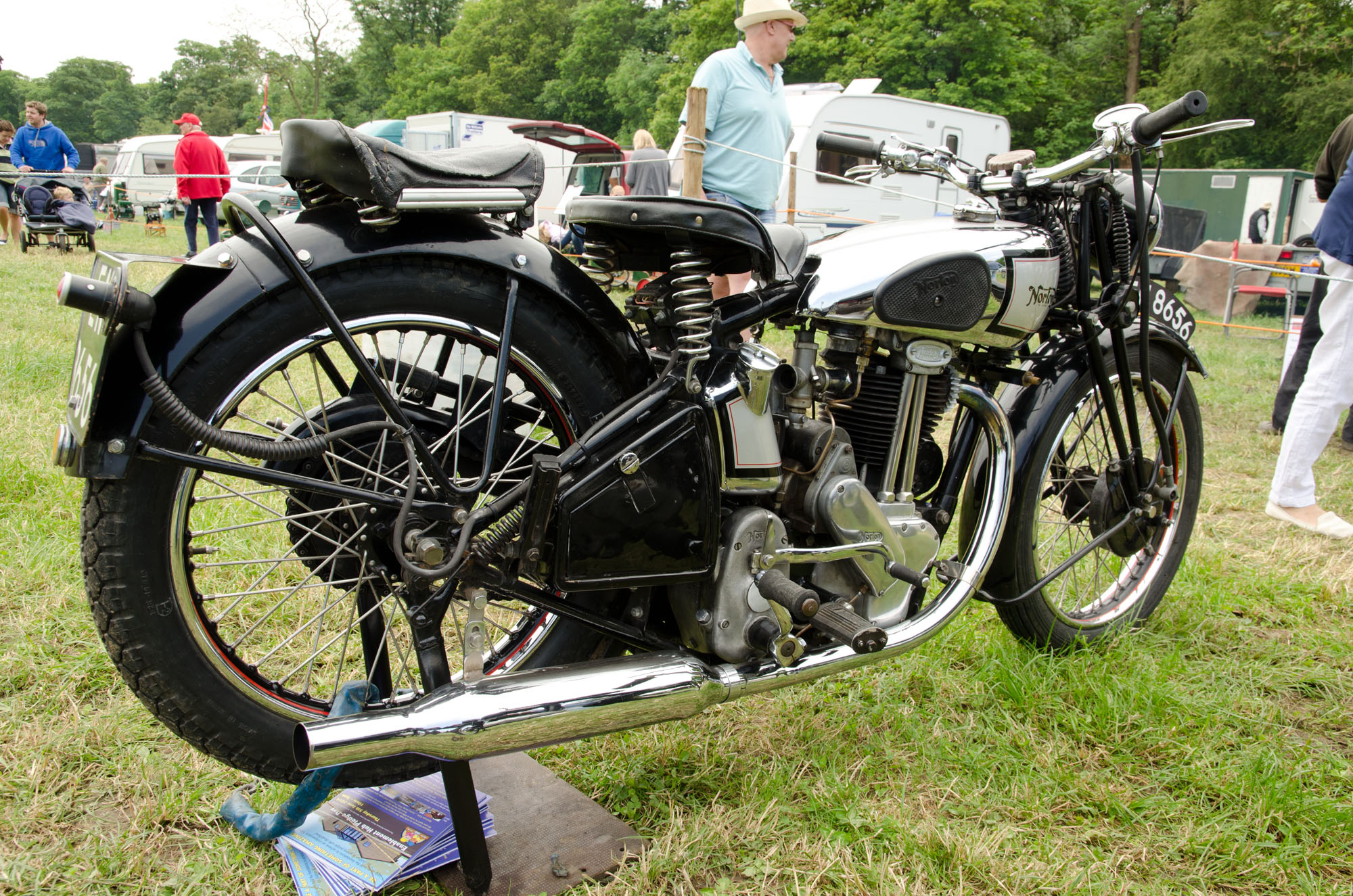 a group of motorcycles on a grassy field