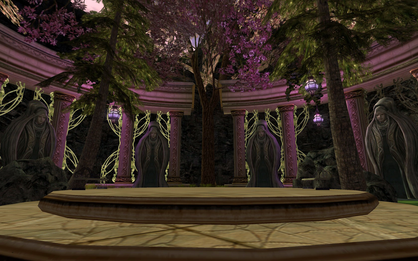 a stage in the middle of a park area with large pillars, and trees