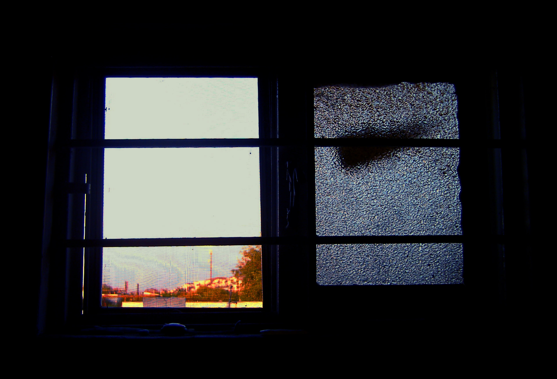 an open window shows the sky and a plane