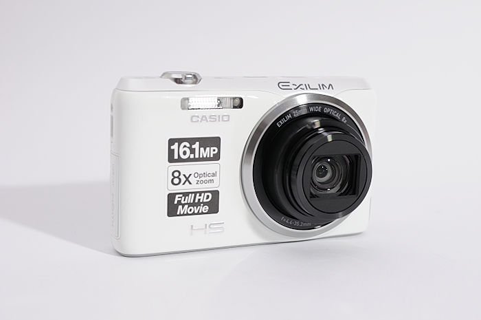 a white digital camera sitting on a table