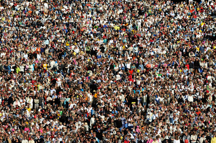 a large group of people are gathered in the shape of a crowd