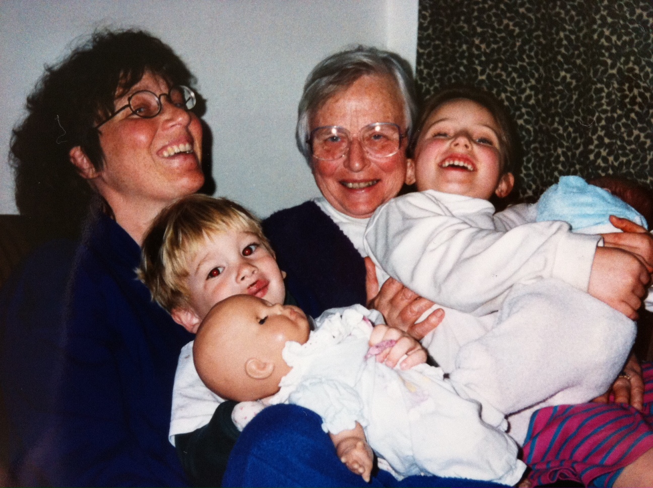 three people standing around and smiling at the camera