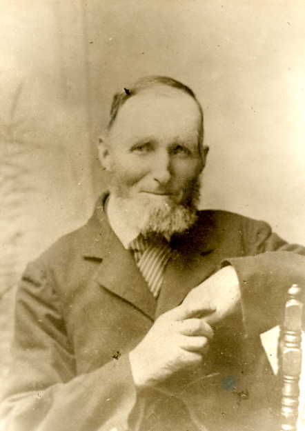 an old po of a man with a beard and a suit