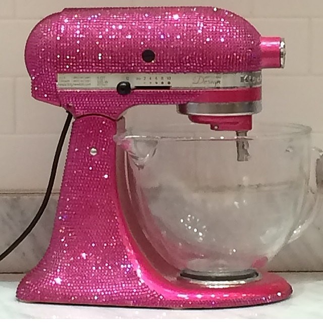 a pink mixer has been used as a cake decoration