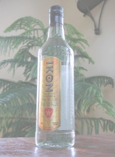 a bottle sitting on top of a wooden table