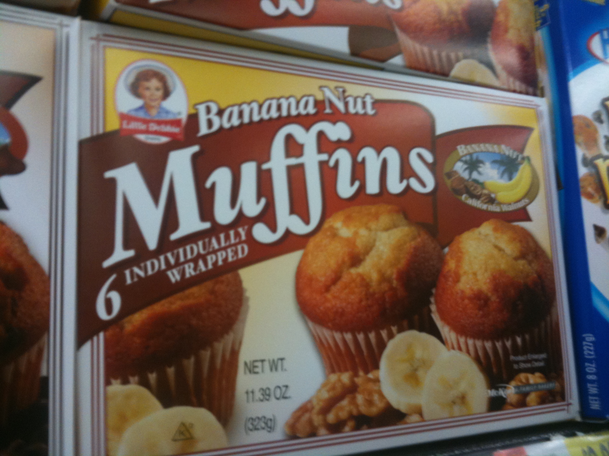 some boxes of muffins are stacked on top of each other