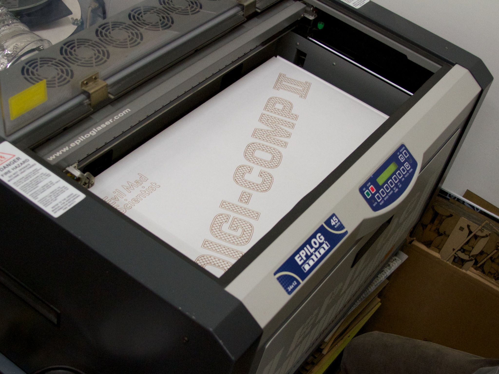 a printer machine with the word design on it