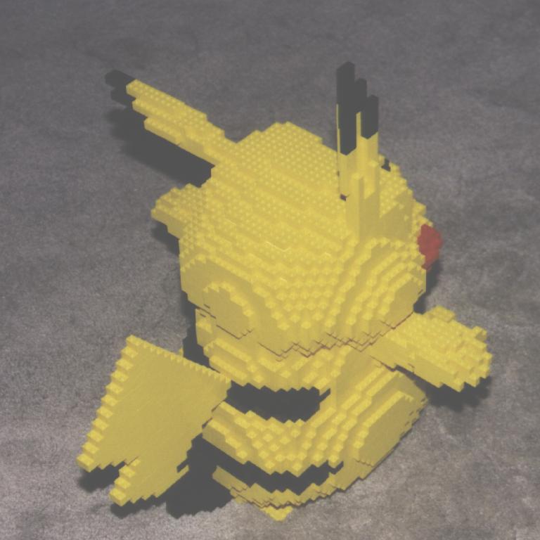 a yellow lego building sits on the floor