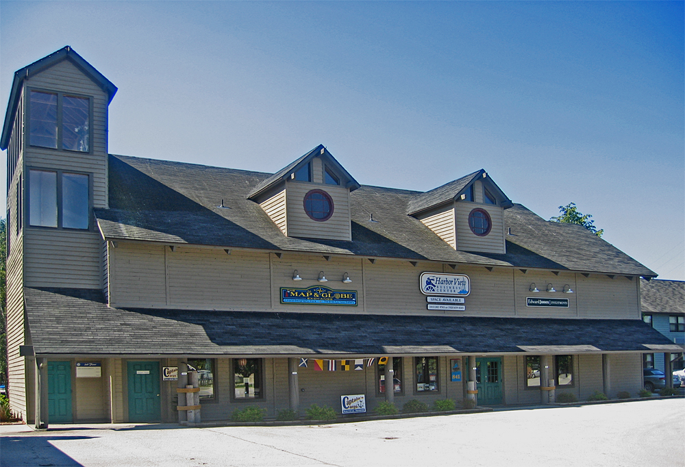 the store on the corner of the street has three clocks