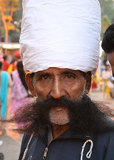 a man with a giant hat on his head