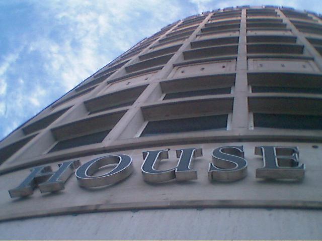 a close up view of a building that says house