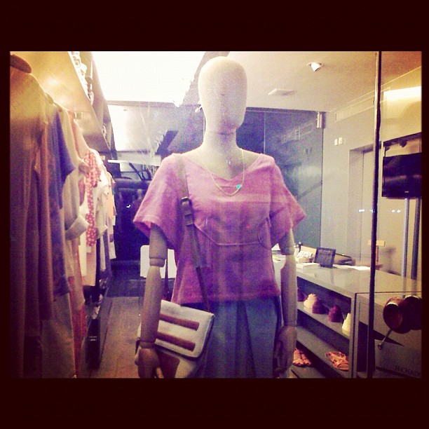 the mannequin is dressed in pink and grey