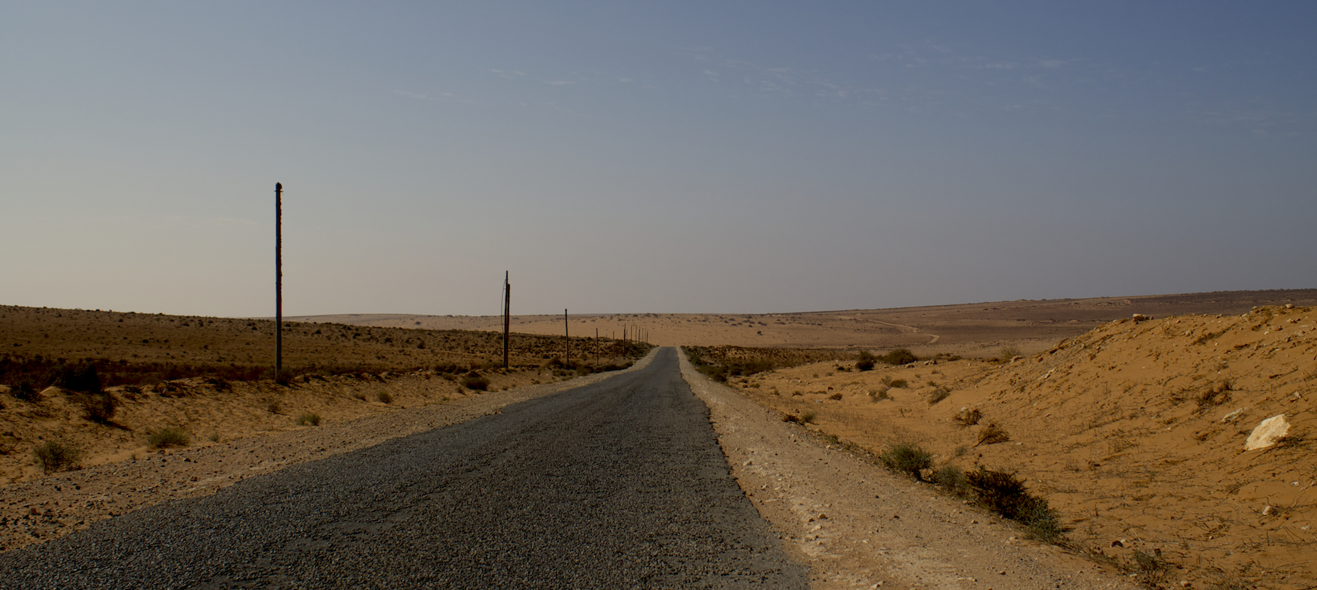 a road in the desert that is nearly empty