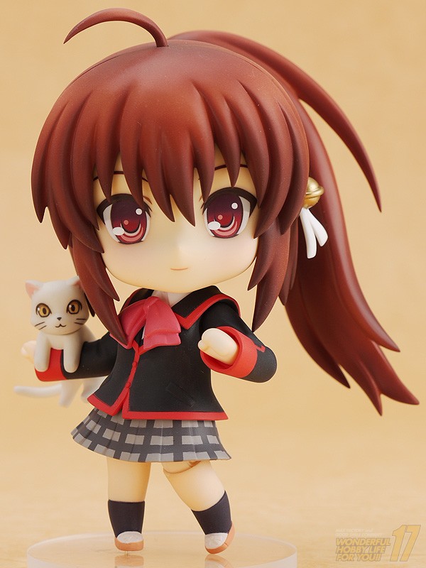 a close up of a figurine with red hair holding a cat