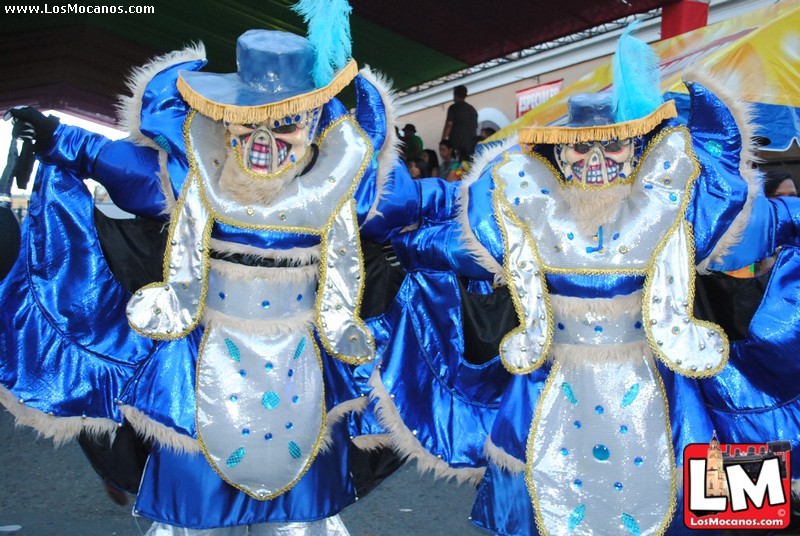 three dancers in blue costumes and black hair