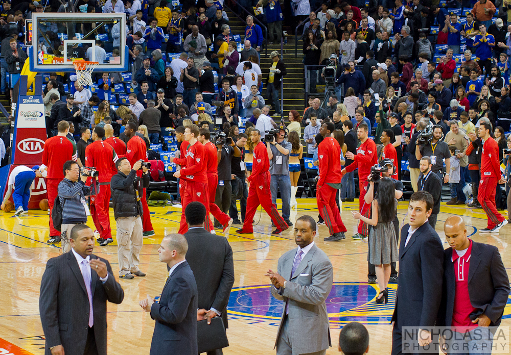 an arena filled with a number of people in suits and ties