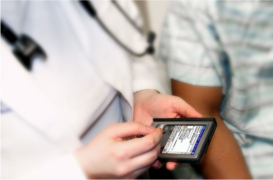 a doctor examines a digital device in his hands