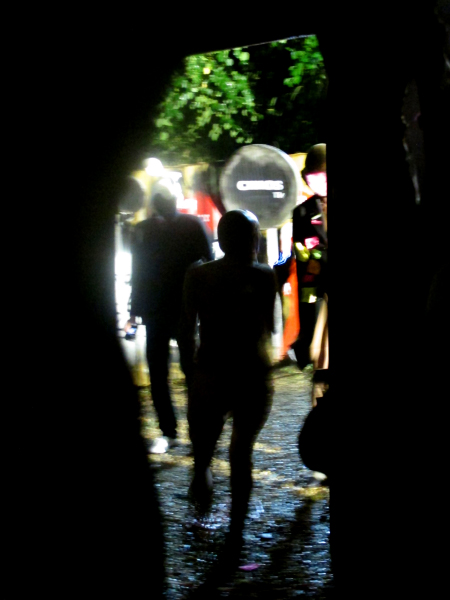 silhouette of people walking through an open doorway