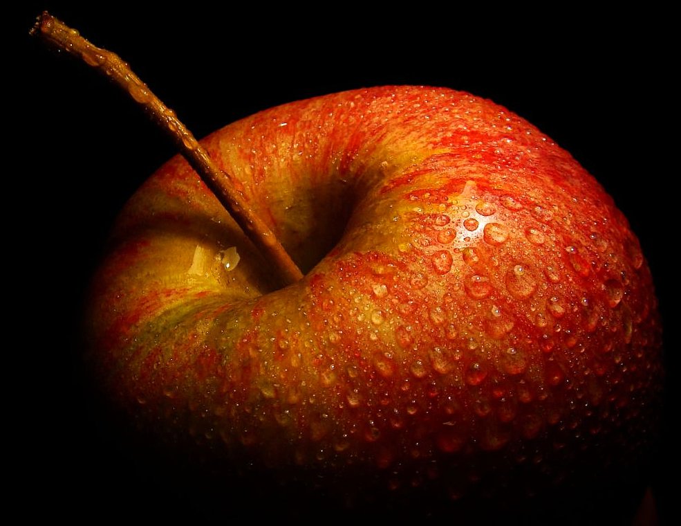 closeup po of apple with drops of water on it